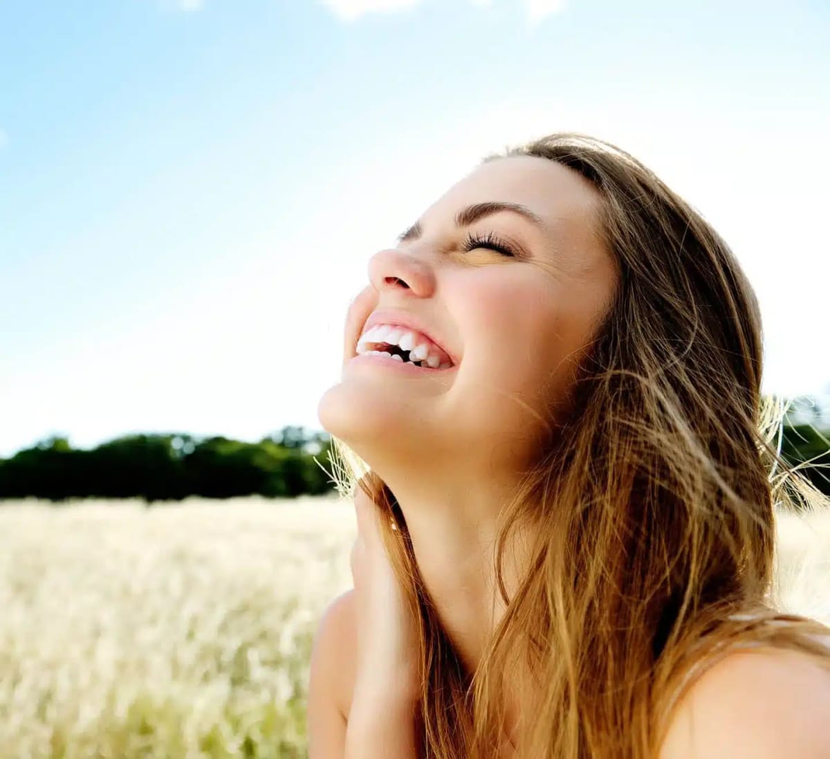 A patient enjoying a bright, healthy smile at Honest Teeth Dentistry